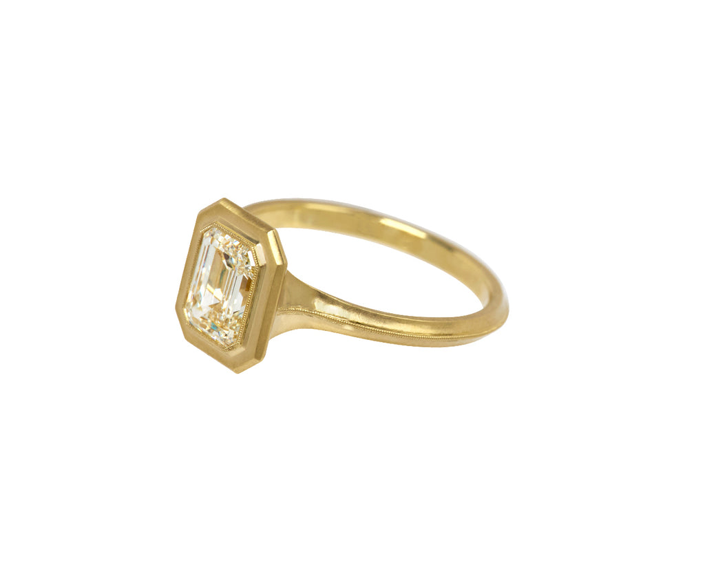 Jin Bezel Emerald Cut Diamond Solitaire