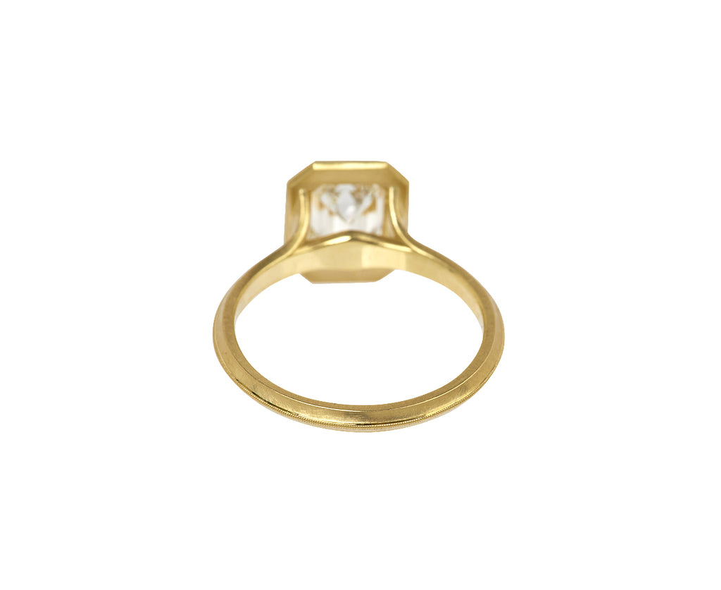 Jin Bezel Emerald Cut Diamond Solitaire