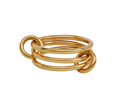A gold-plated multi-band ring with three interlocking circular bands, shown on a plain white background.
